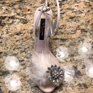4 in. Heels, ivory, feather and rhinestones.
